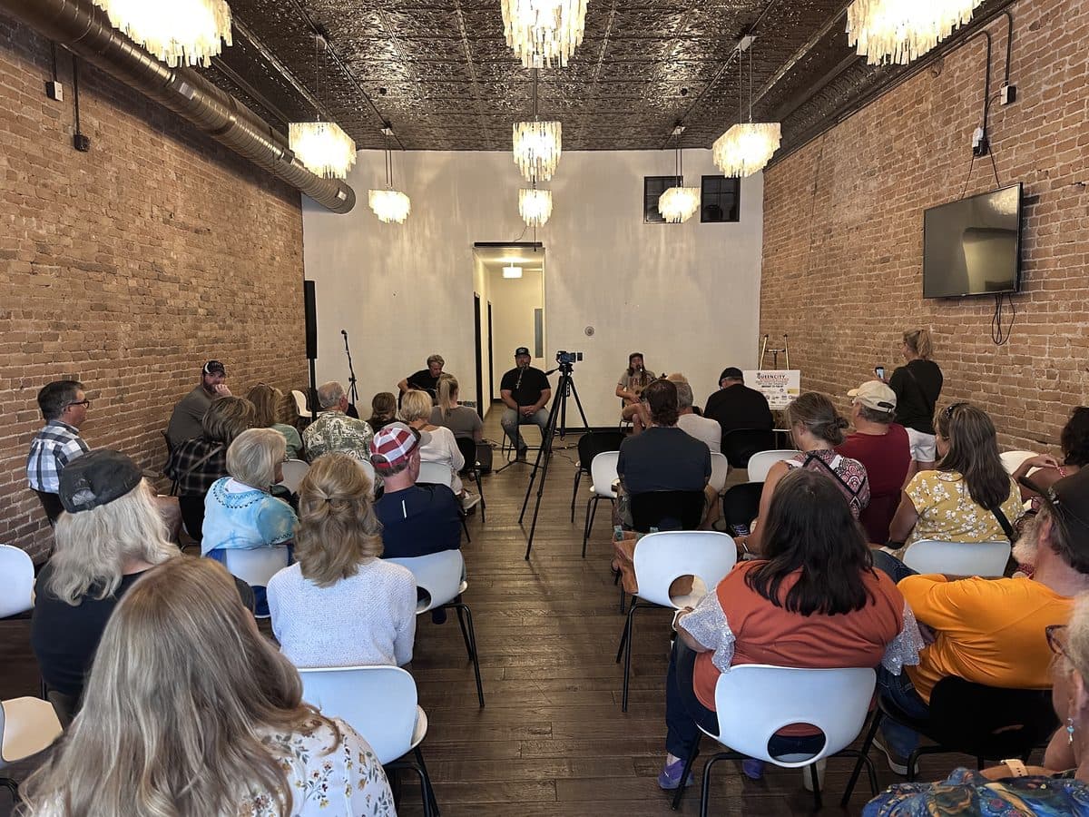 Packed venue during a songwriter round at the Invitational